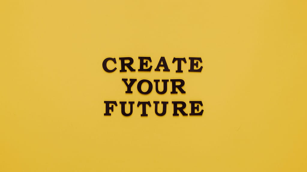Bold text 'CREATE YOUR FUTURE' on minimalist yellow background. Inspiring design.